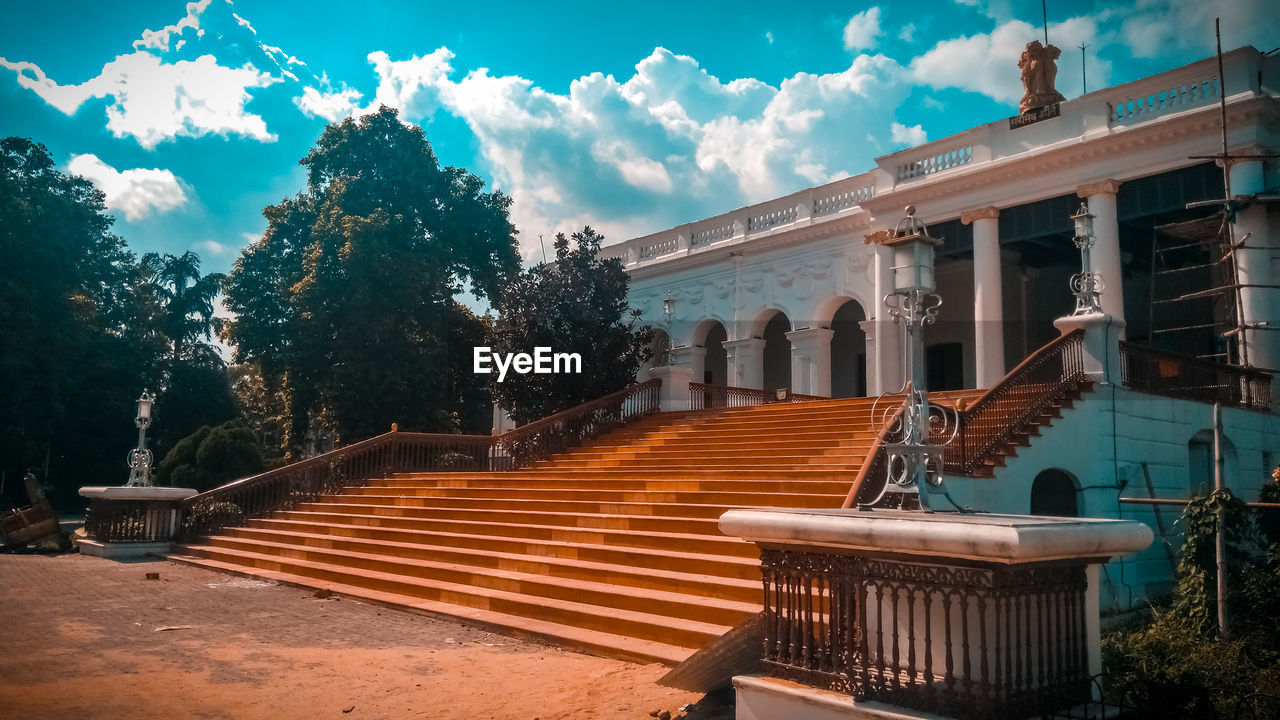 EMPTY BENCHES AGAINST SKY