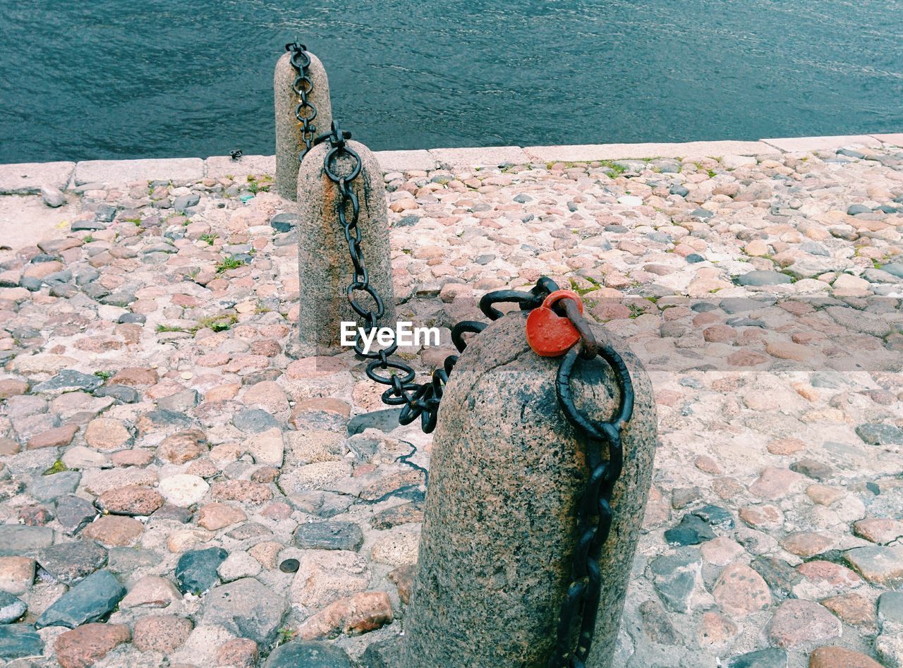 Chain on bollards by sea