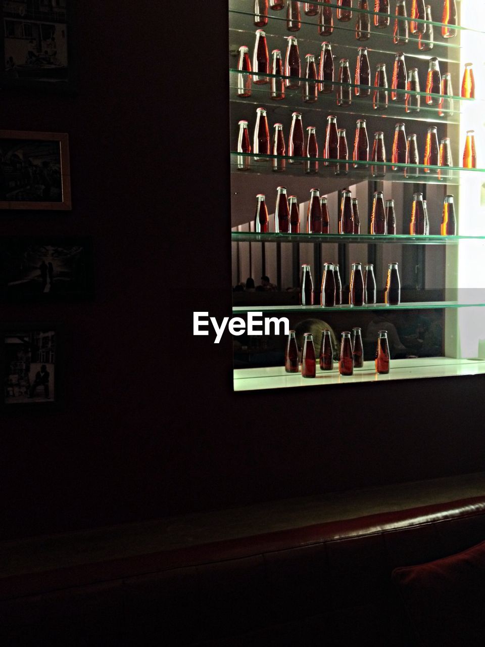 Drink bottles on shelf in restaurant