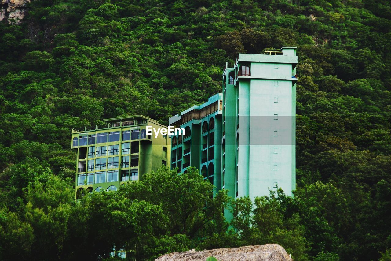 Low angle view of buildings against mountain