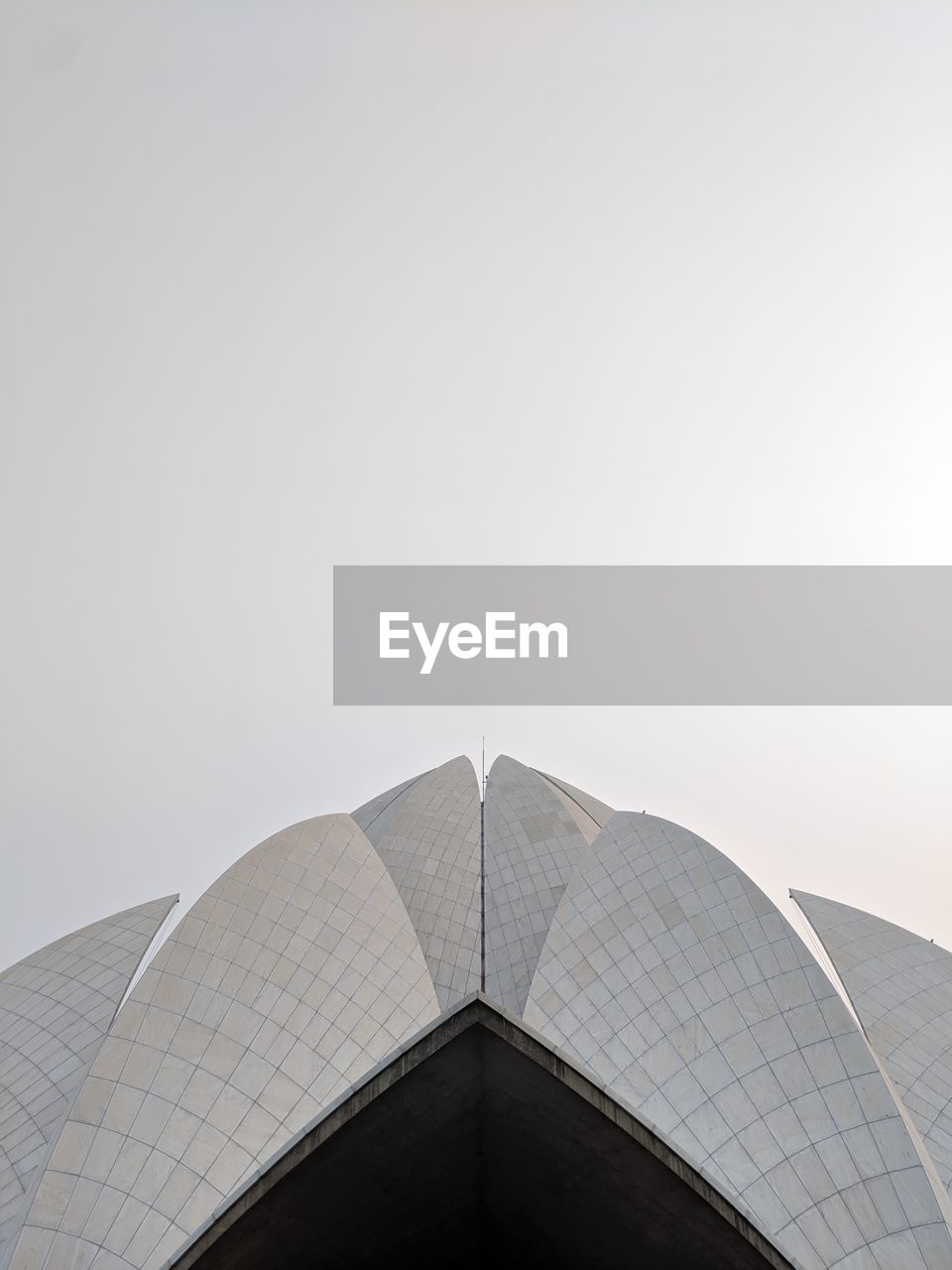 Low angle view of lotus temple against clear sky