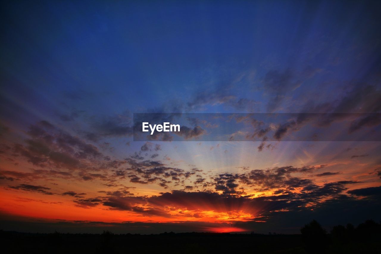 SILHOUETTE OF LANDSCAPE AT SUNSET