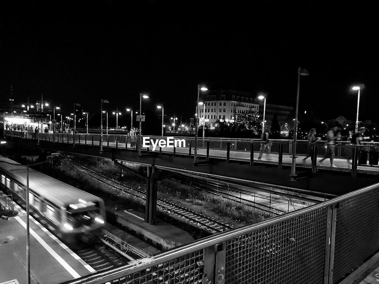 RAILROAD TRACKS AT NIGHT