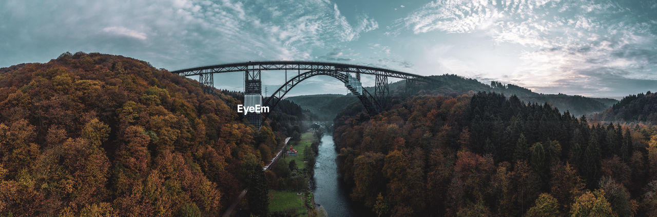 Panoramic view of bridge over river against sky