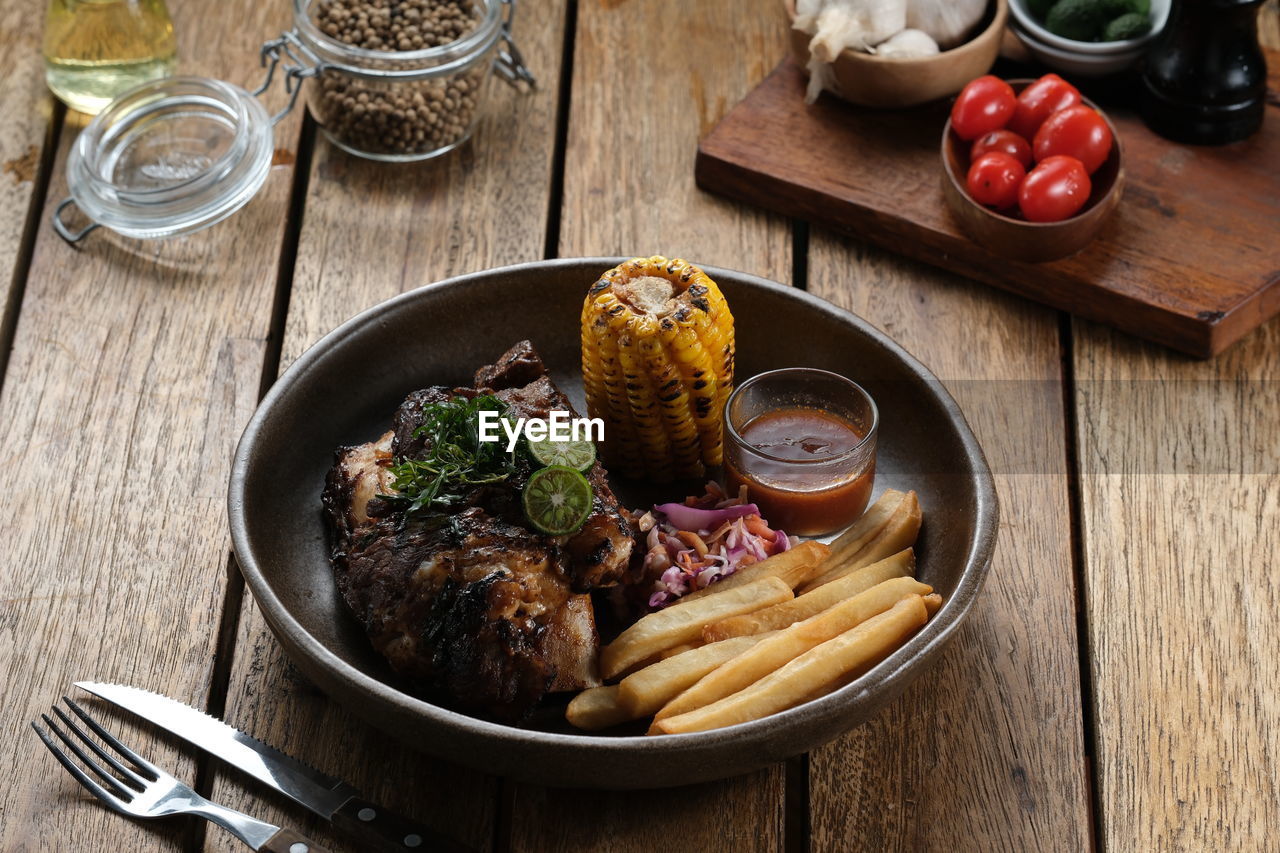 Barbeque grilled ribs served on a neatly arranged plate