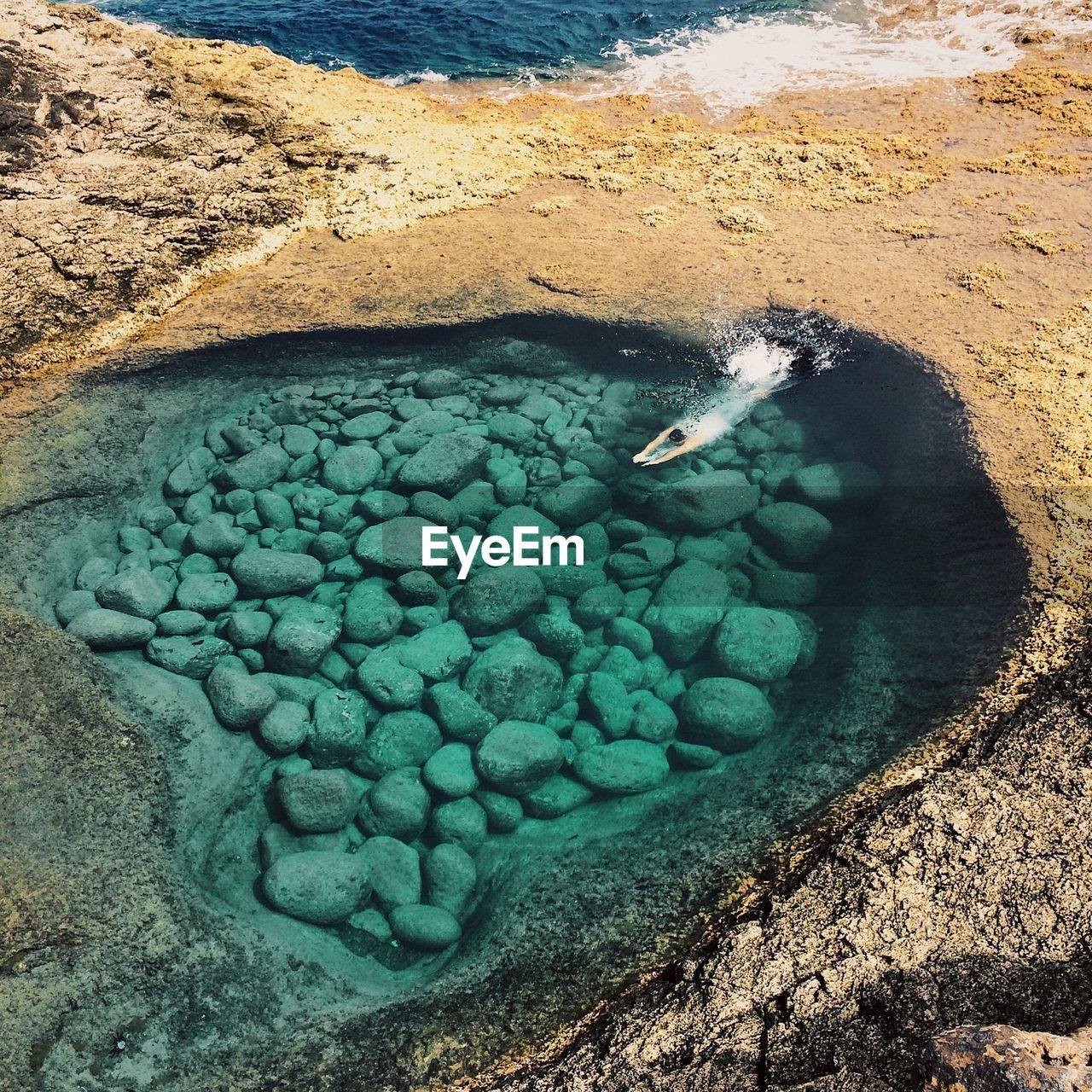 High angle view of man diving into water