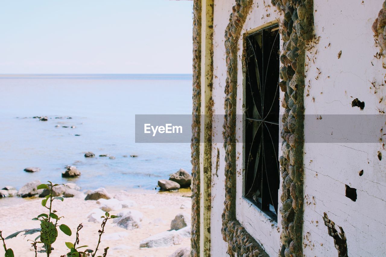 Close-up of abandoned beach against sky