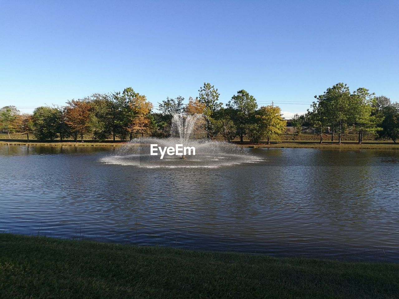 FOUNTAIN IN PARK AGAINST SKY