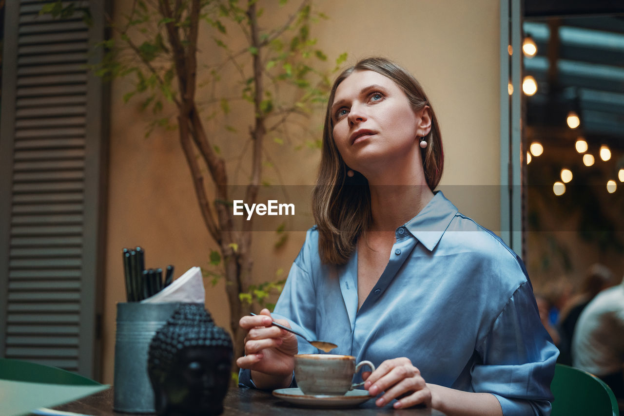 Woman portrait, in a cafe close up