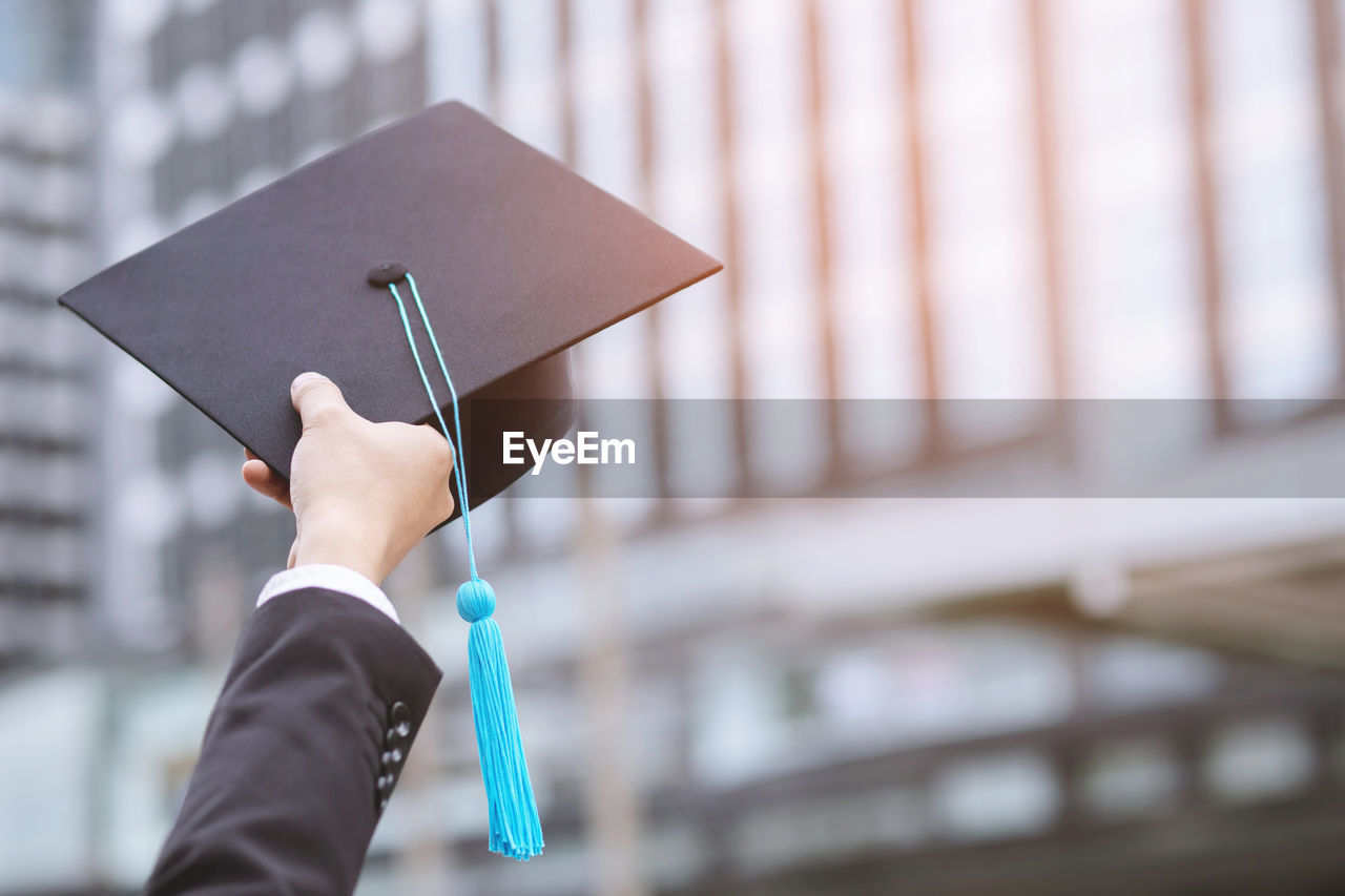 Graduates of the university,of graduate holding hats along with success, education congratulation 