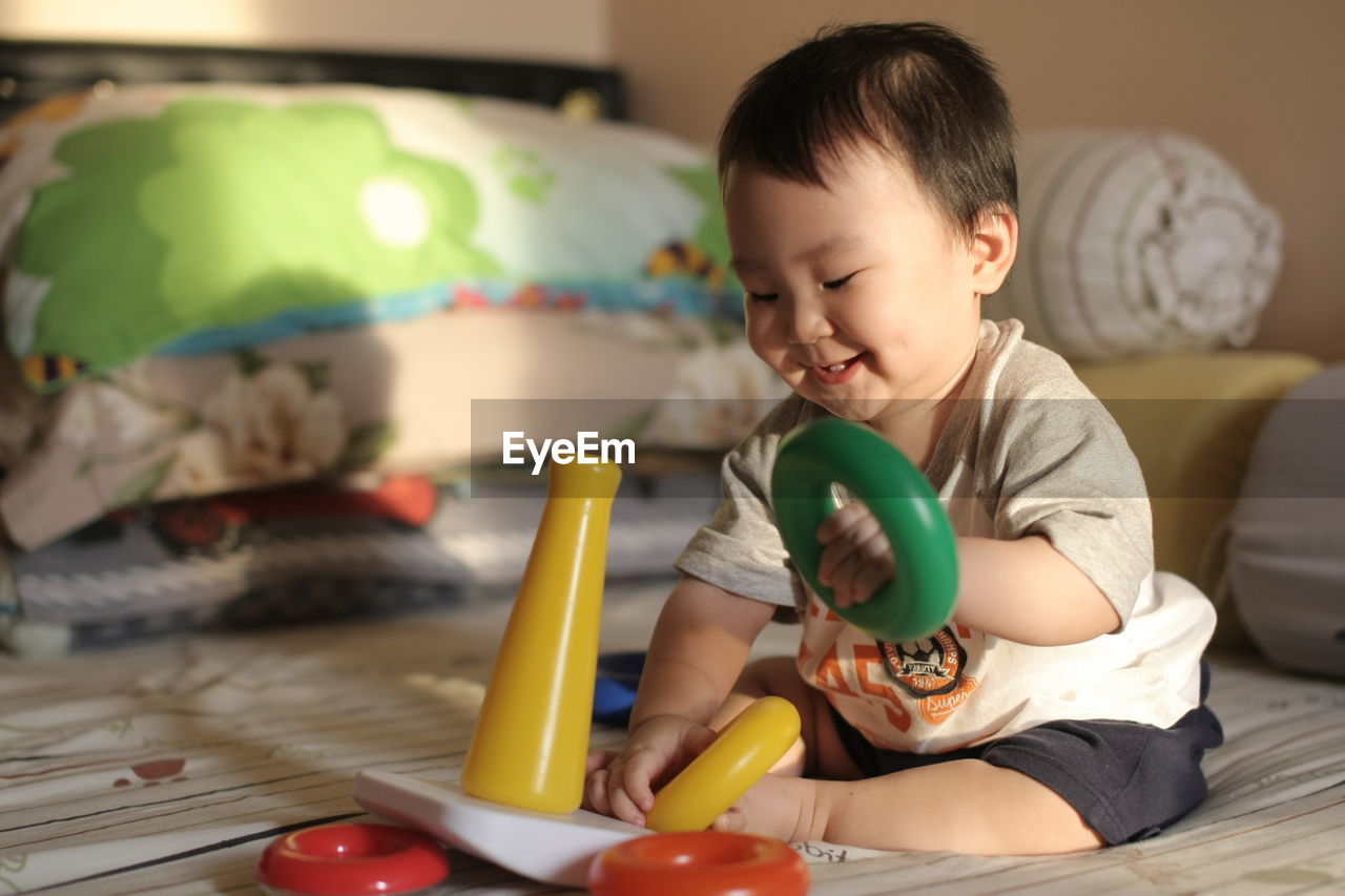 Infant  playing educational stacking toys