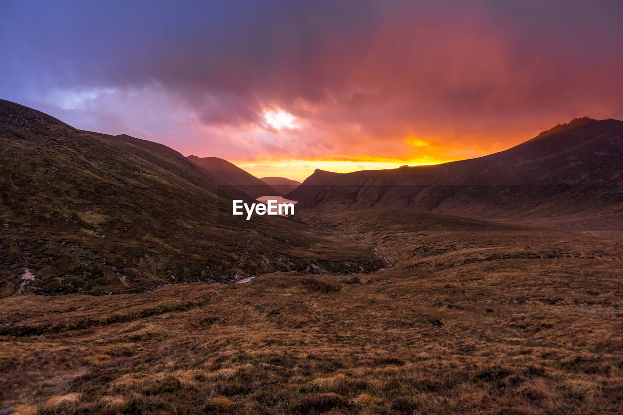 SCENIC VIEW OF LANDSCAPE DURING SUNSET