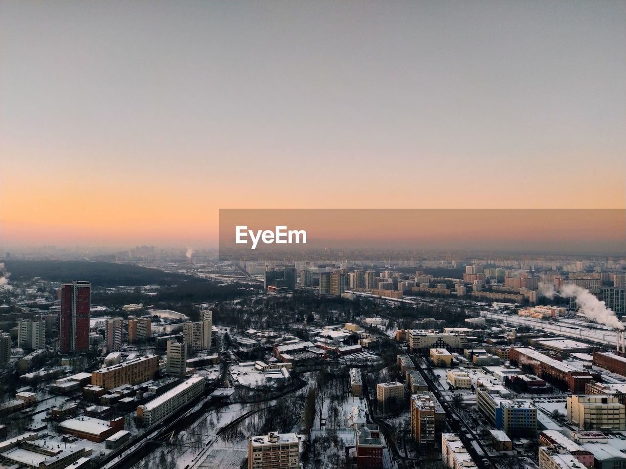 High angle view of buildings against sky during sunset