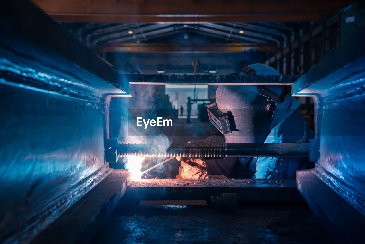 Close-up of worker working in factory