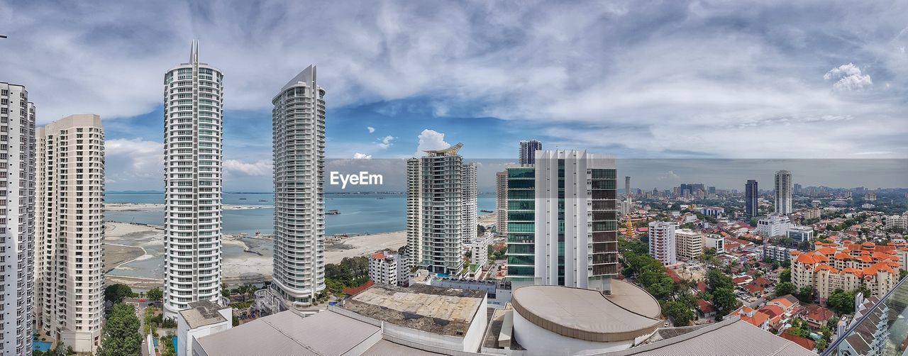 PANORAMIC VIEW OF BUILDINGS AGAINST SKY