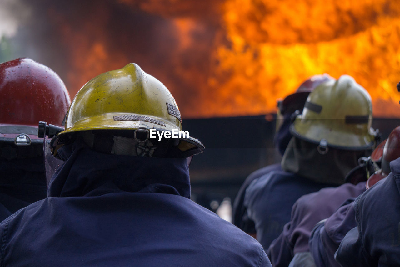 Rear view of firefighters