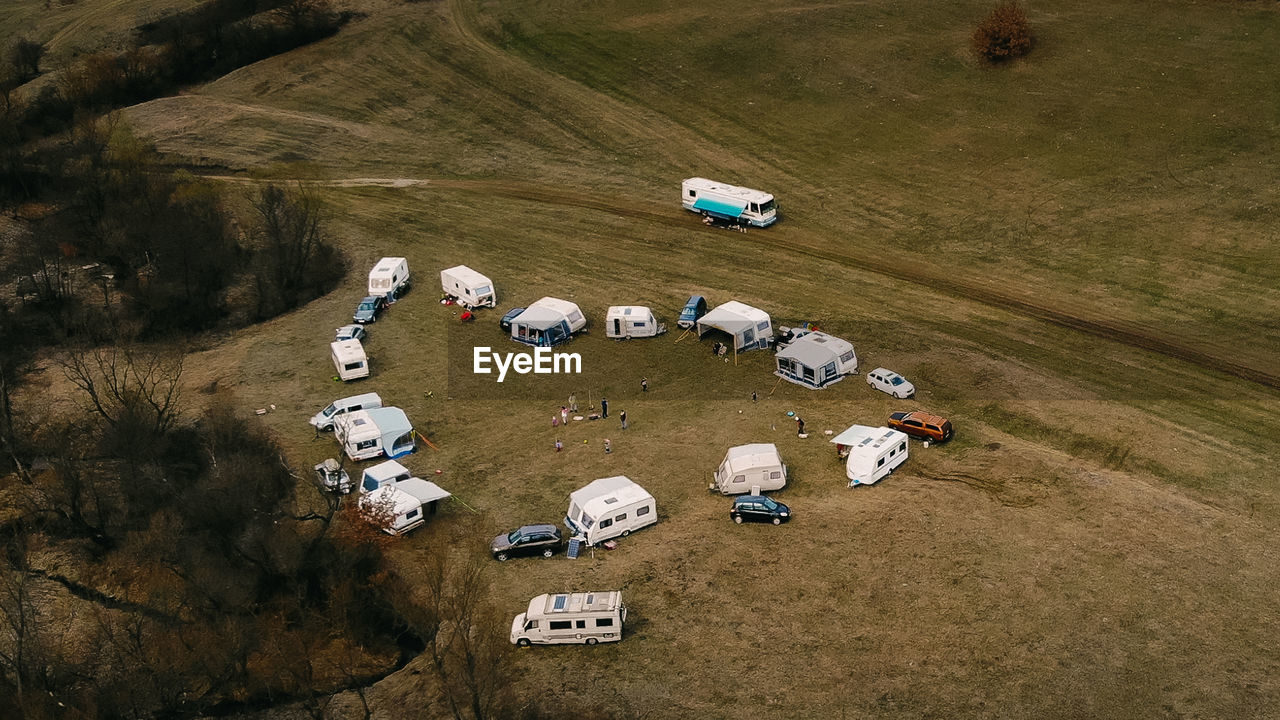 HIGH ANGLE VIEW OF CAR ON LAND