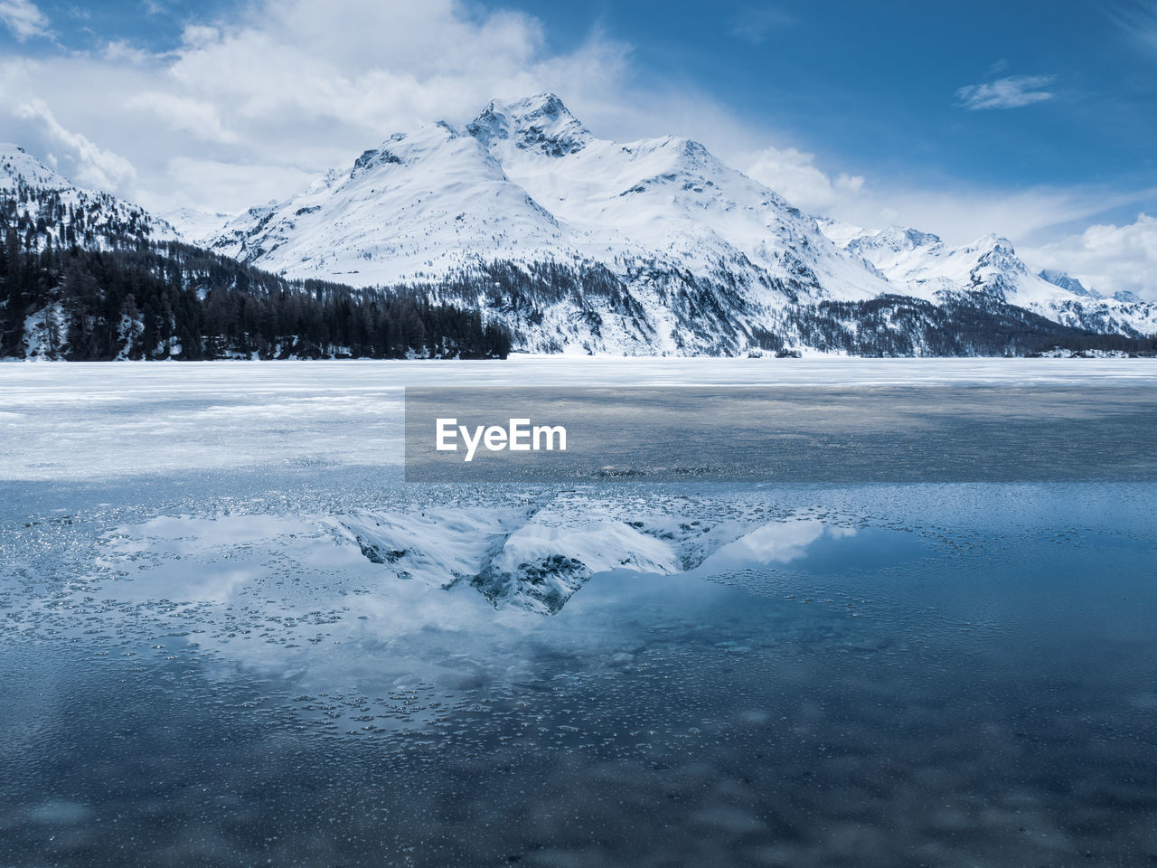 scenic view of snowcapped mountains against sky during winter