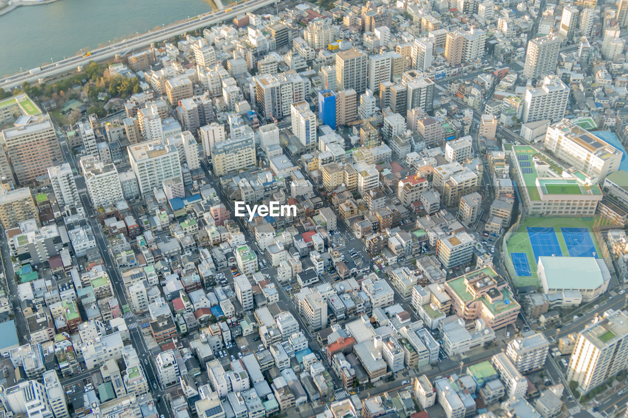 High angle view of crowd and buildings in tokyo city. 