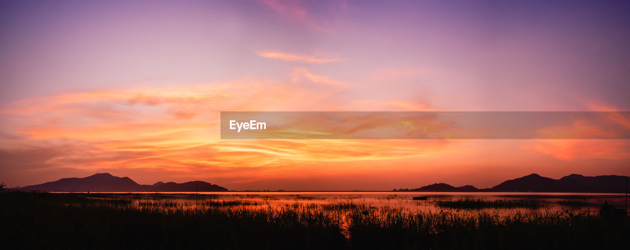 SCENIC VIEW OF LAKE DURING SUNSET