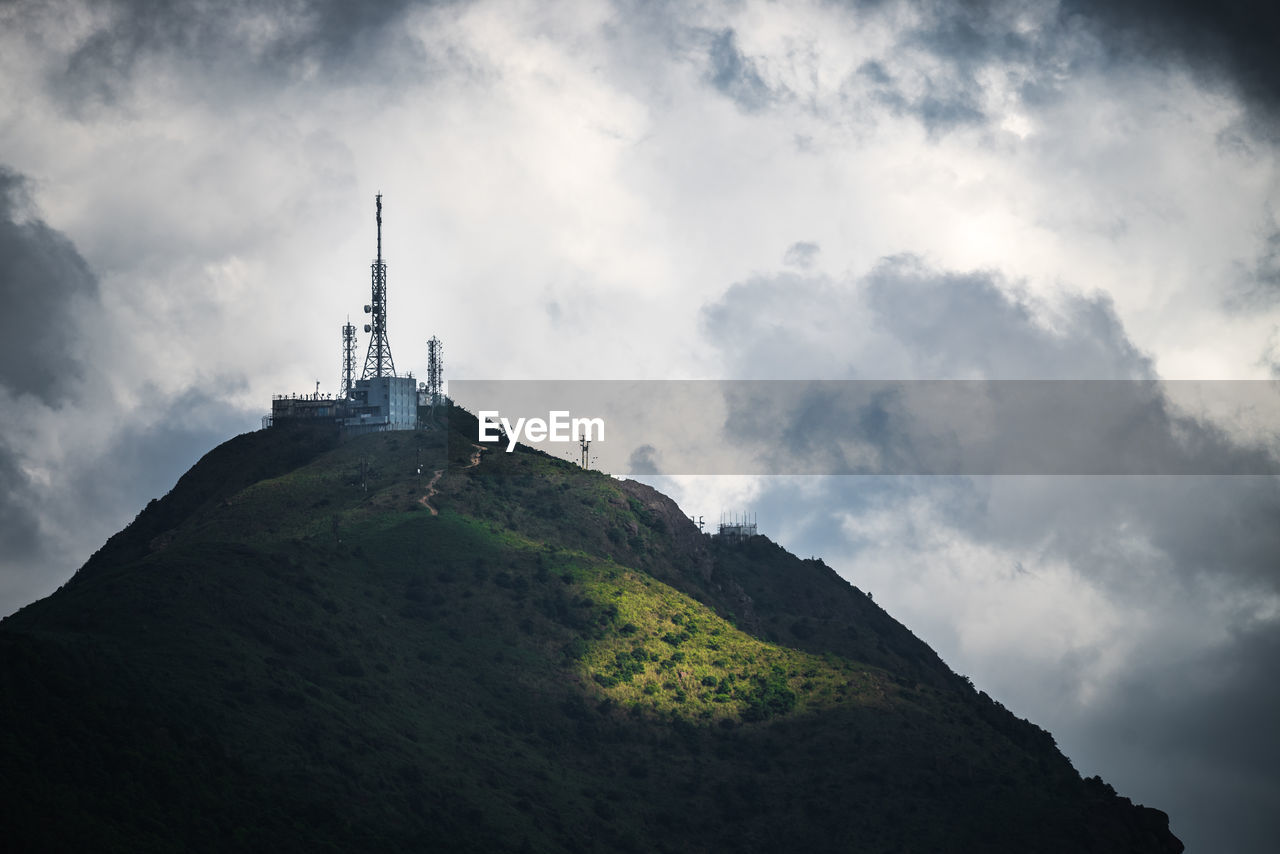 Low angle view of building against cloudy sky