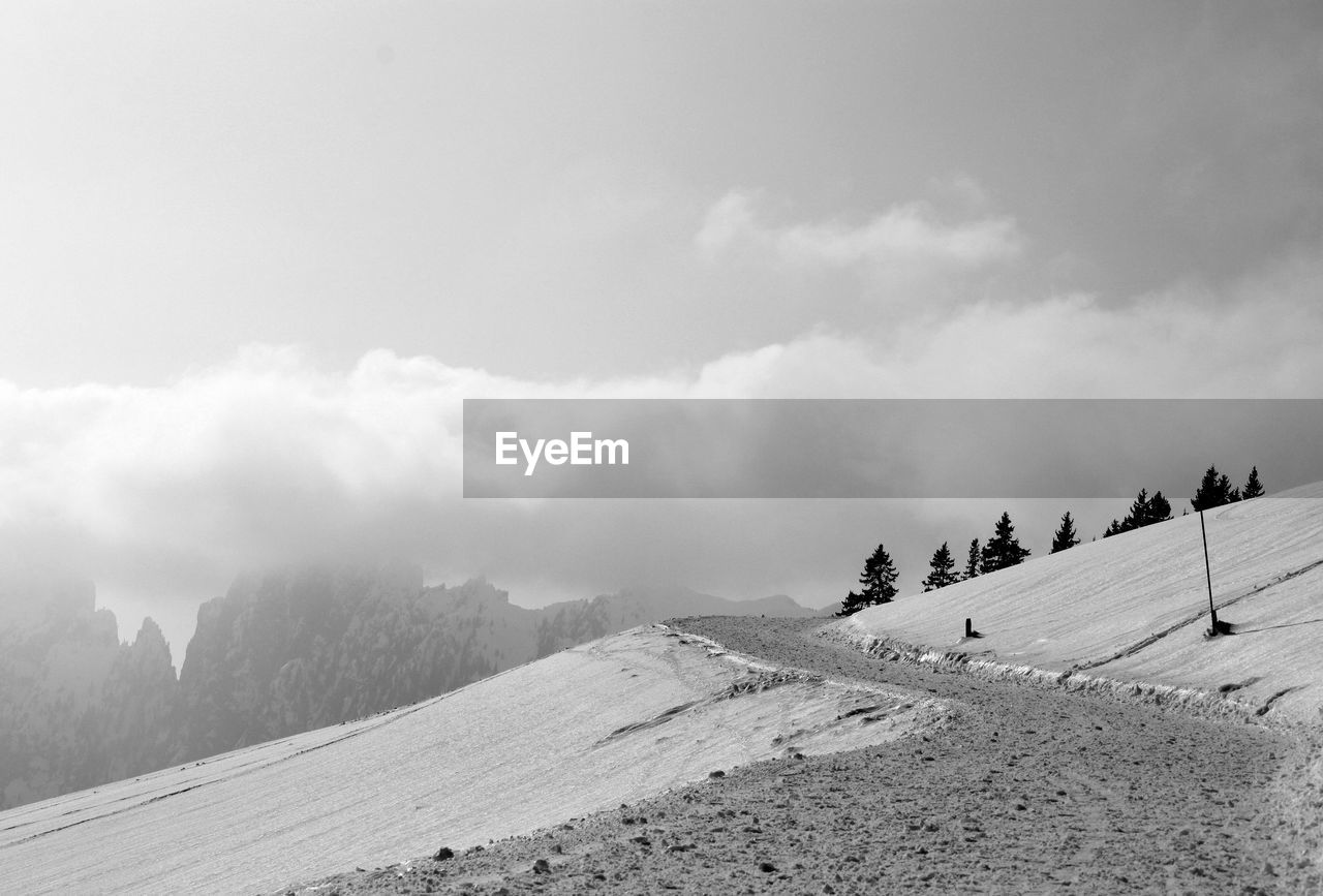 Scenic view of snow covered mountain against sky