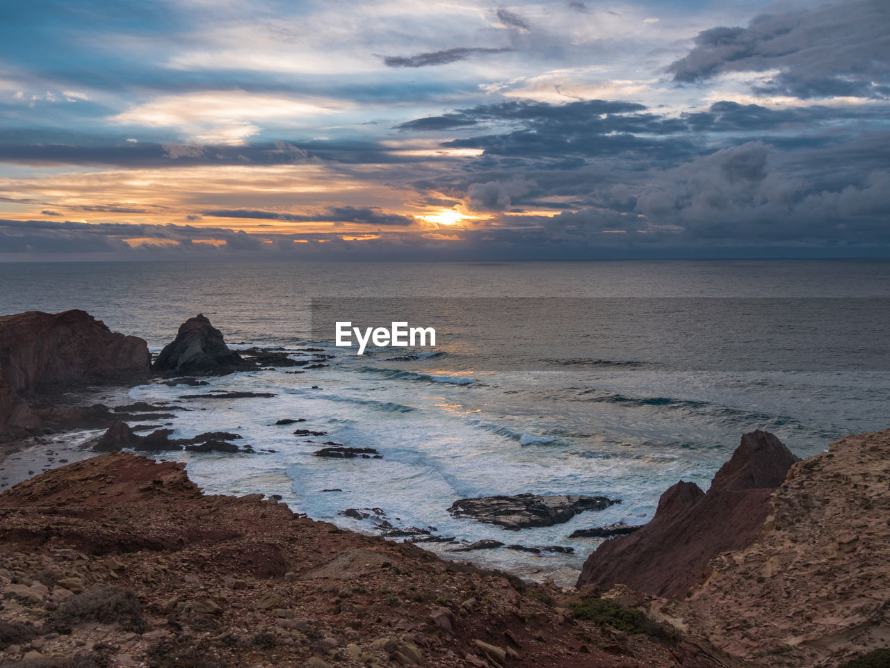 Scenic view of sea against sky during sunset