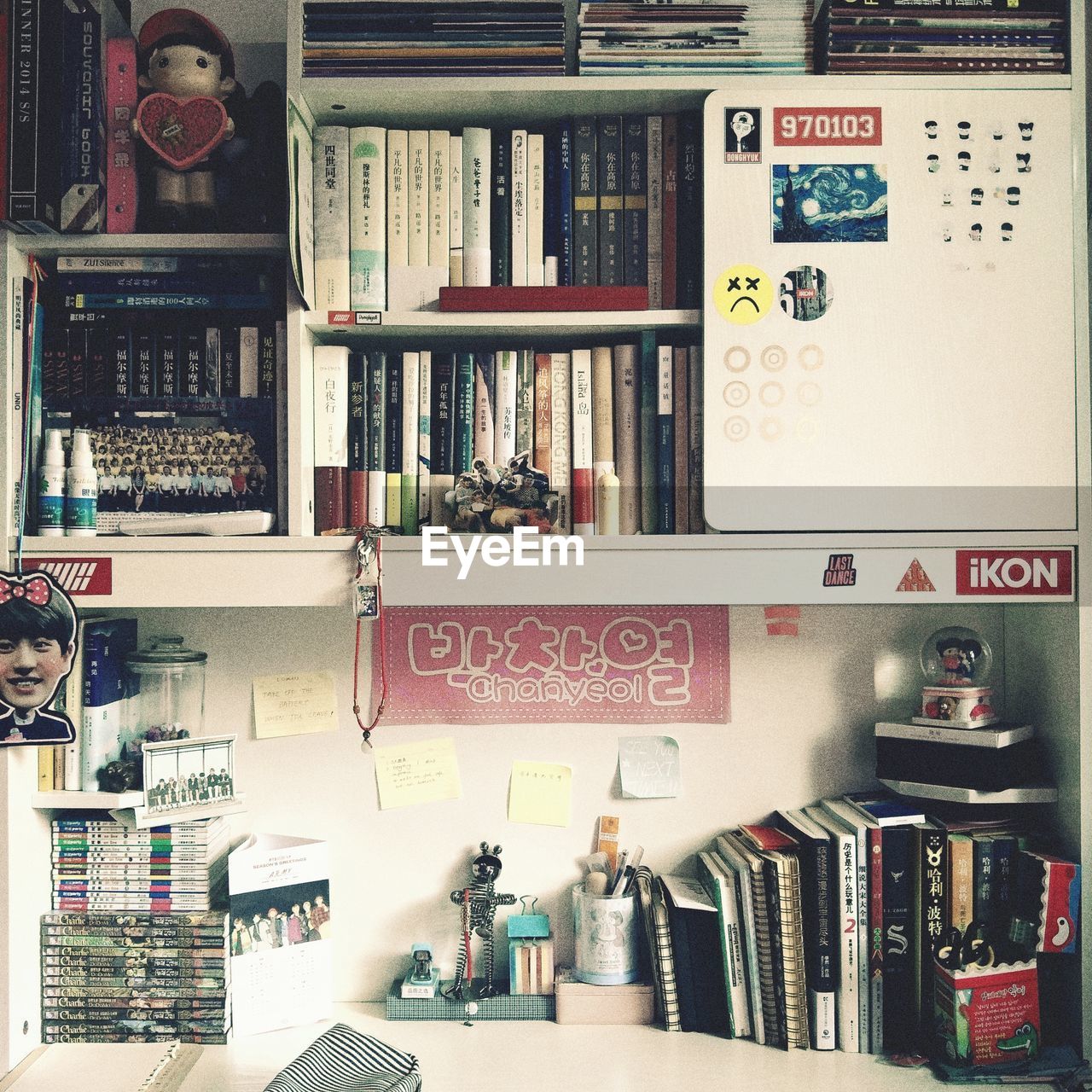 CLOSE-UP OF BOOKS ON SHELF IN LIBRARY