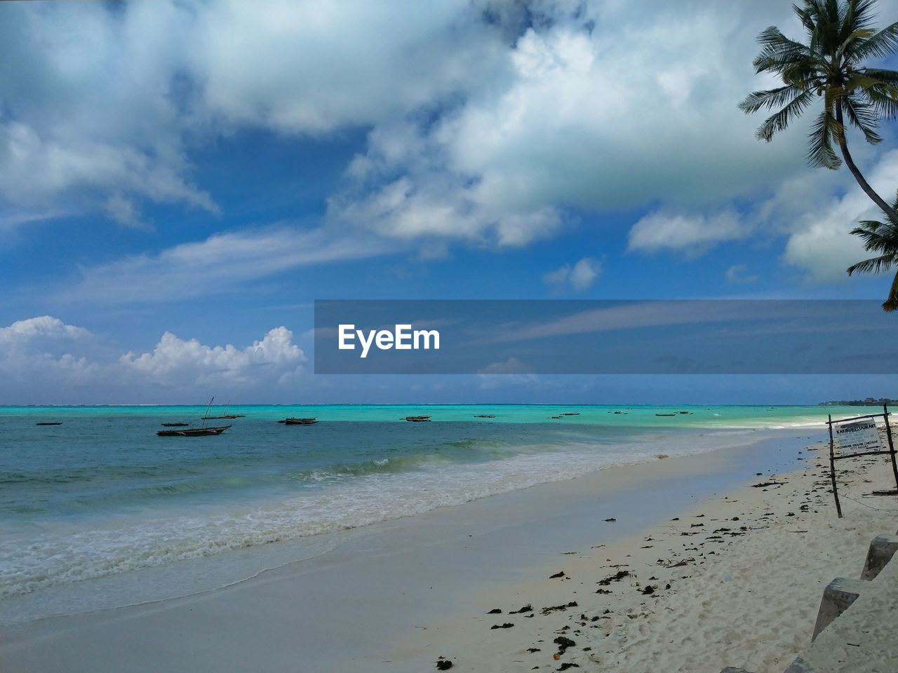 SCENIC VIEW OF SEA SHORE AGAINST SKY