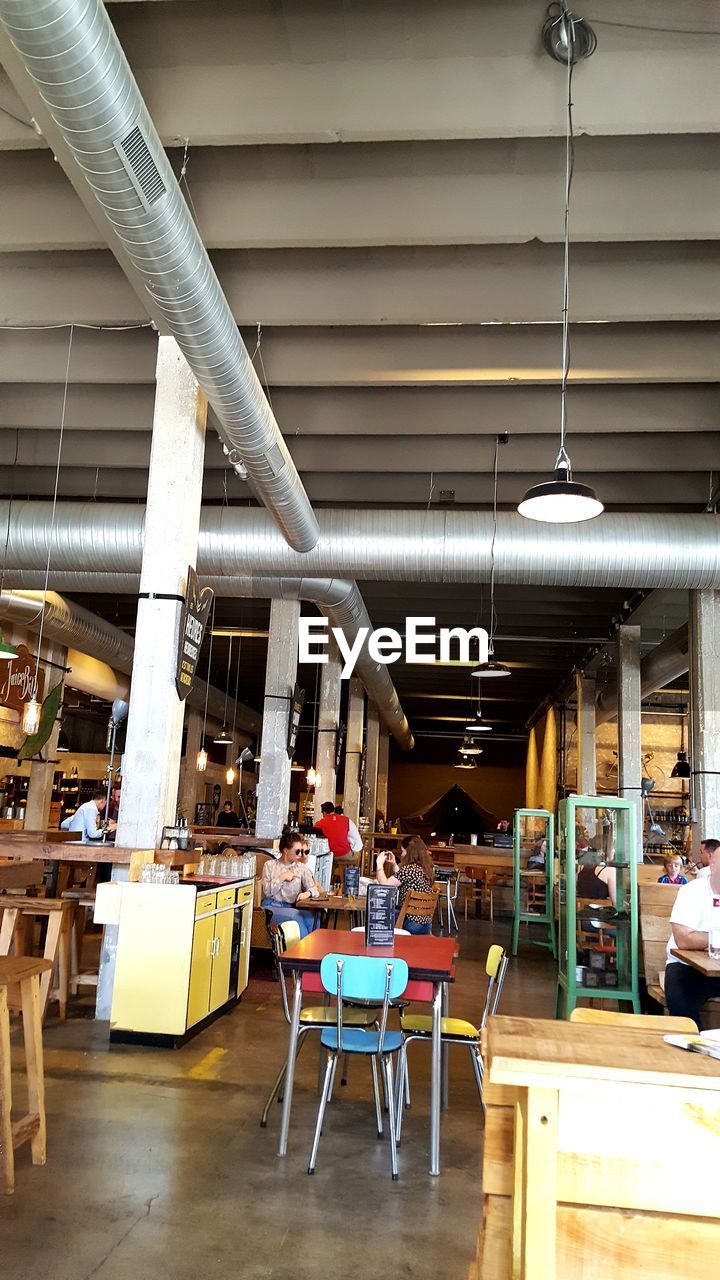 CHAIRS AND TABLES AT RESTAURANT