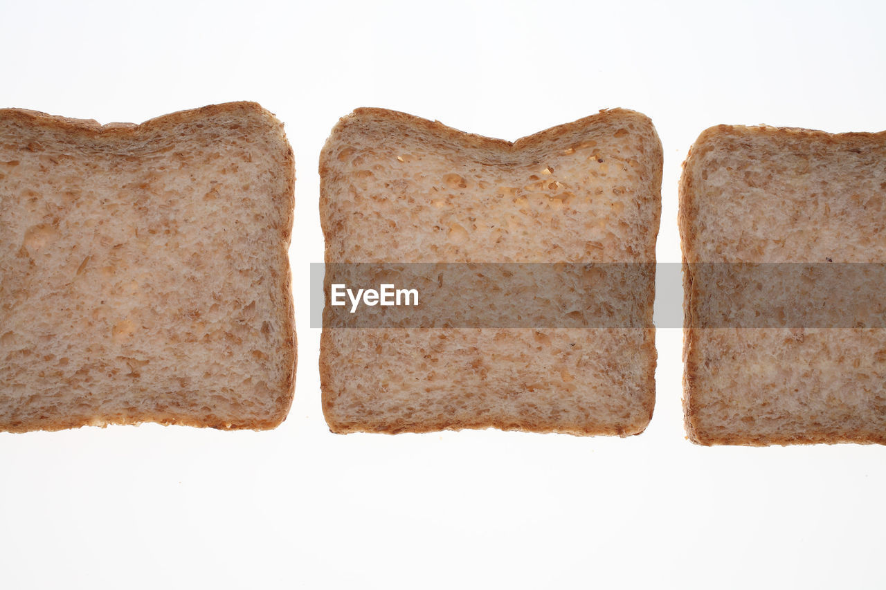 Close-up of bread against white background