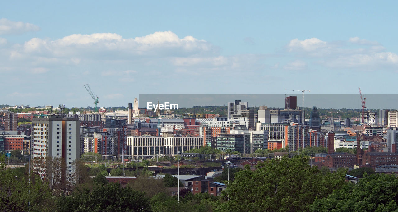 High angle view of buildings in city against sky