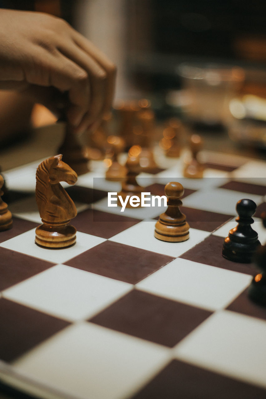 Close-up of chess pieces on table