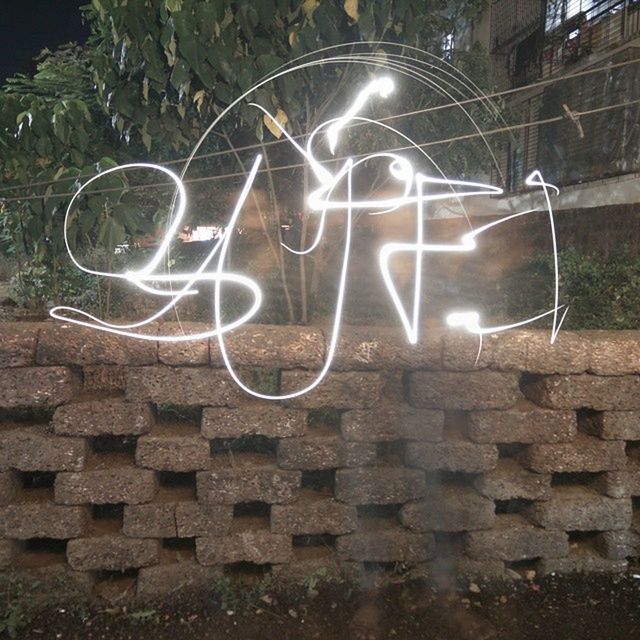 VIEW OF ILLUMINATED BRICK WALL