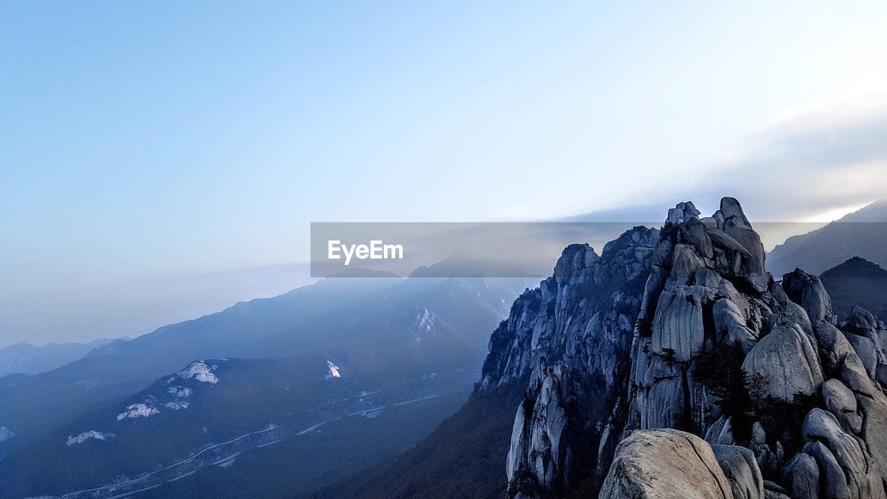 Scenic view of mountains against sky during winter