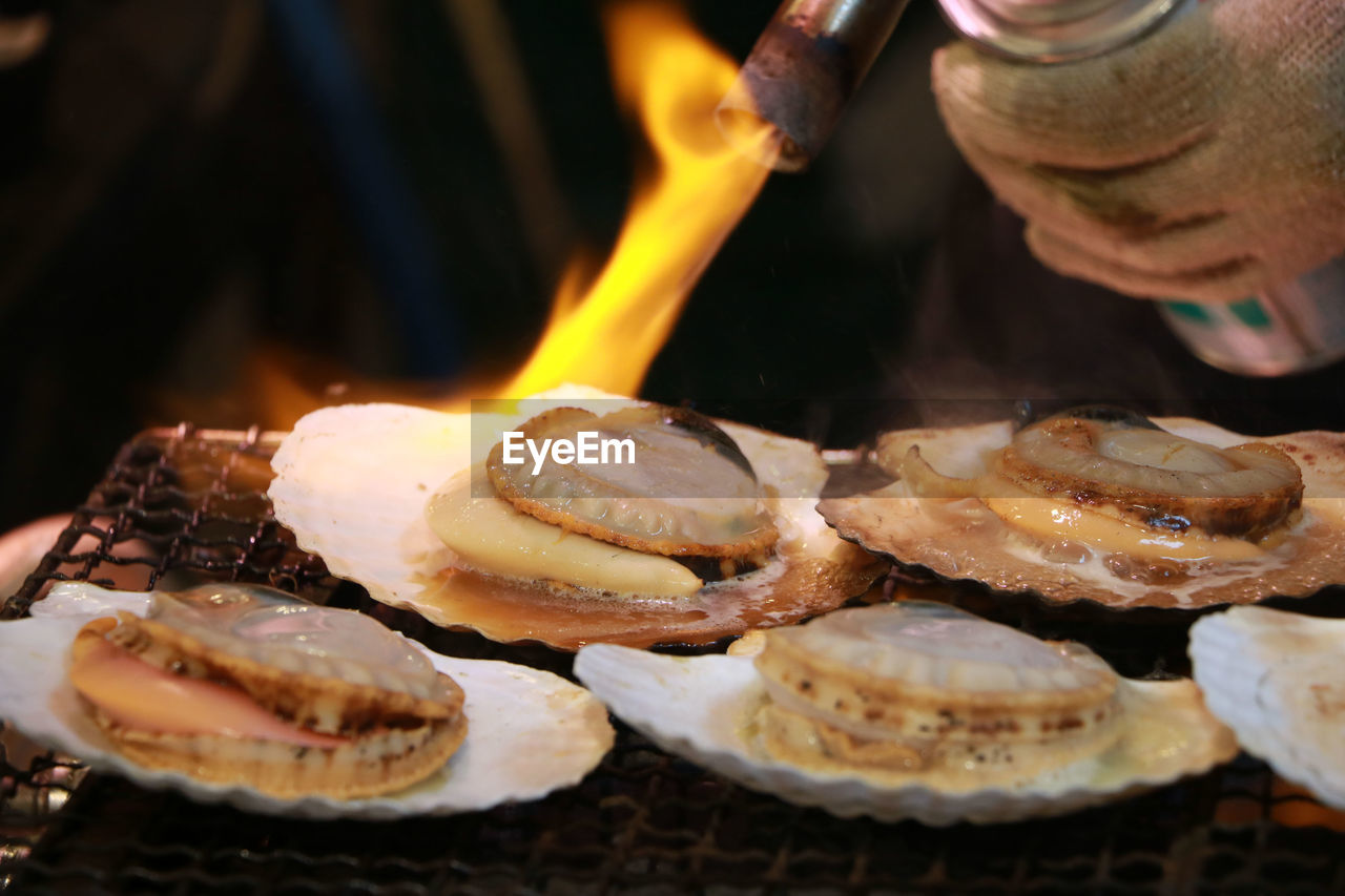 Cropped hand making seafood