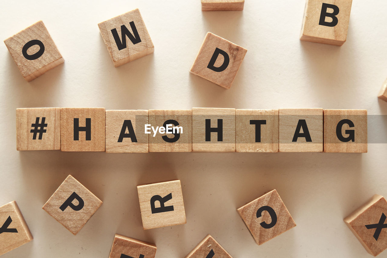 High angle view of text on wooden blocks over table