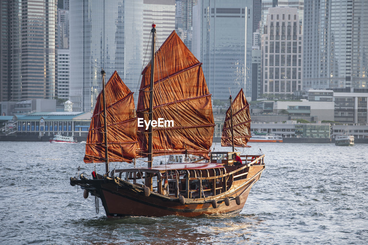 Traditional junk boat at victoria harbour in hong kong