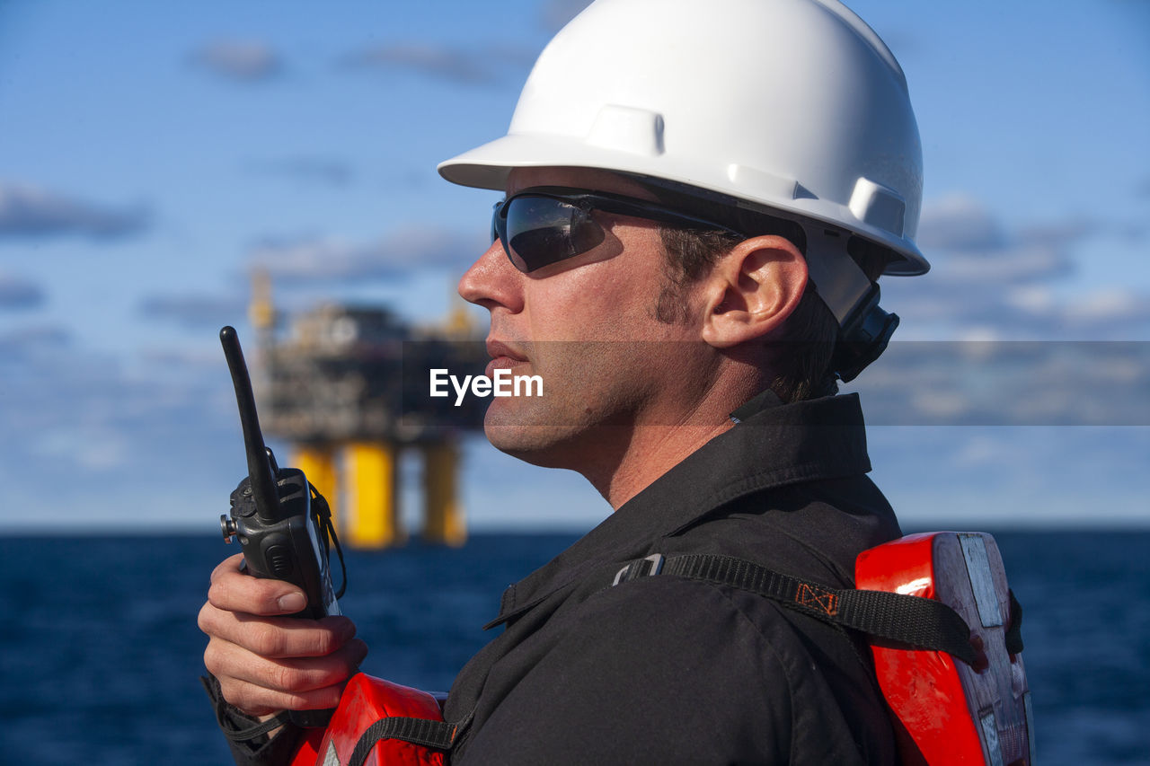 Offshore energy production with person on ship