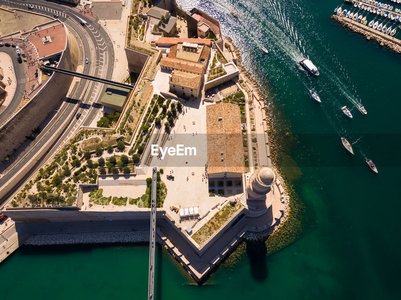 Aerial view of buildings by sea