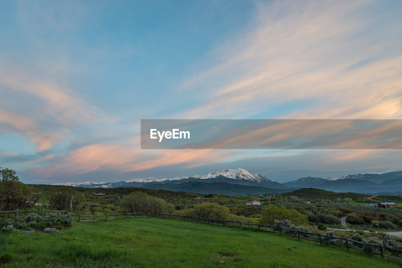 SCENIC VIEW OF LANDSCAPE AGAINST SKY DURING SUNRISE