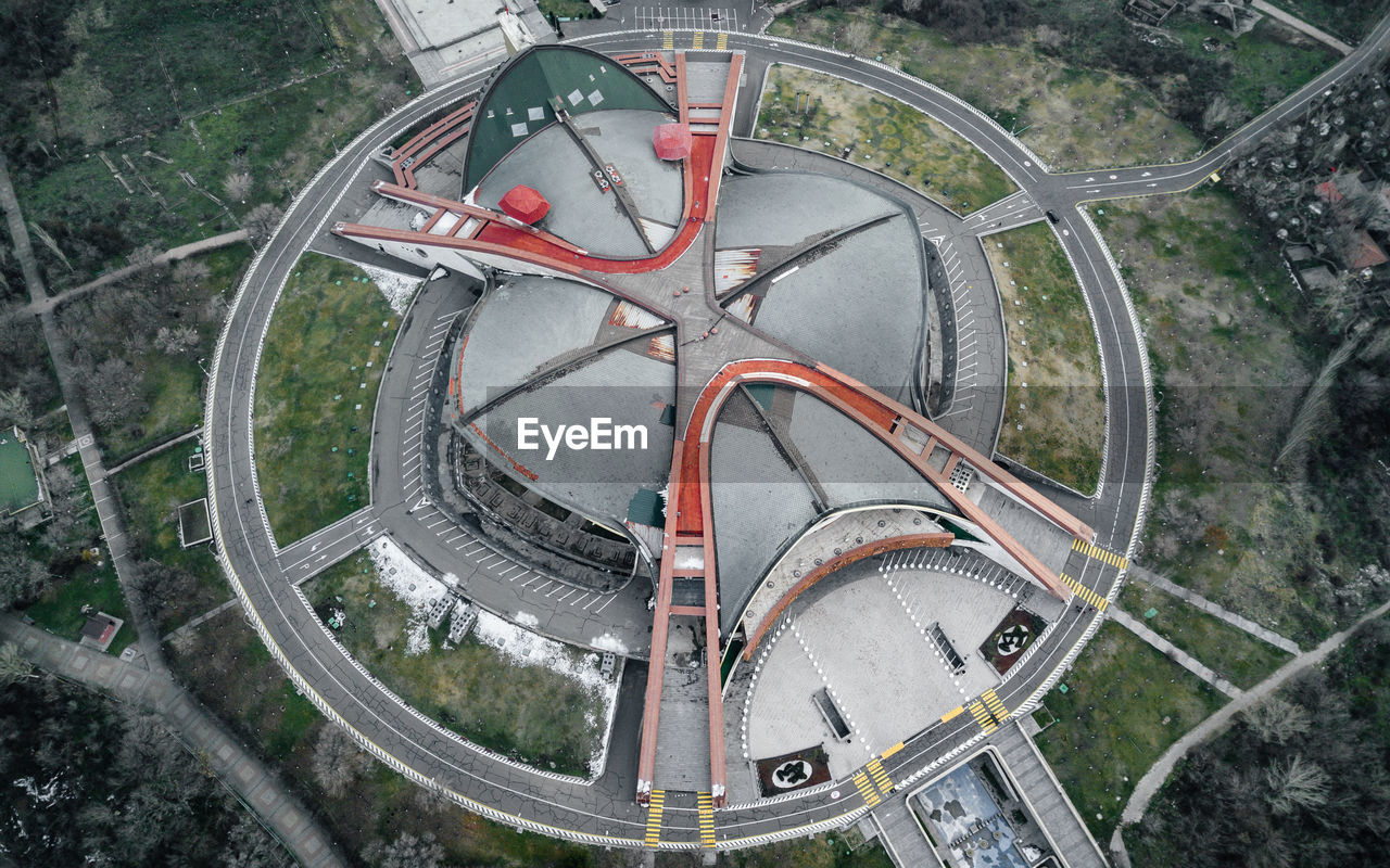 HIGH ANGLE VIEW OF RAILROAD TRACKS BY ROAD