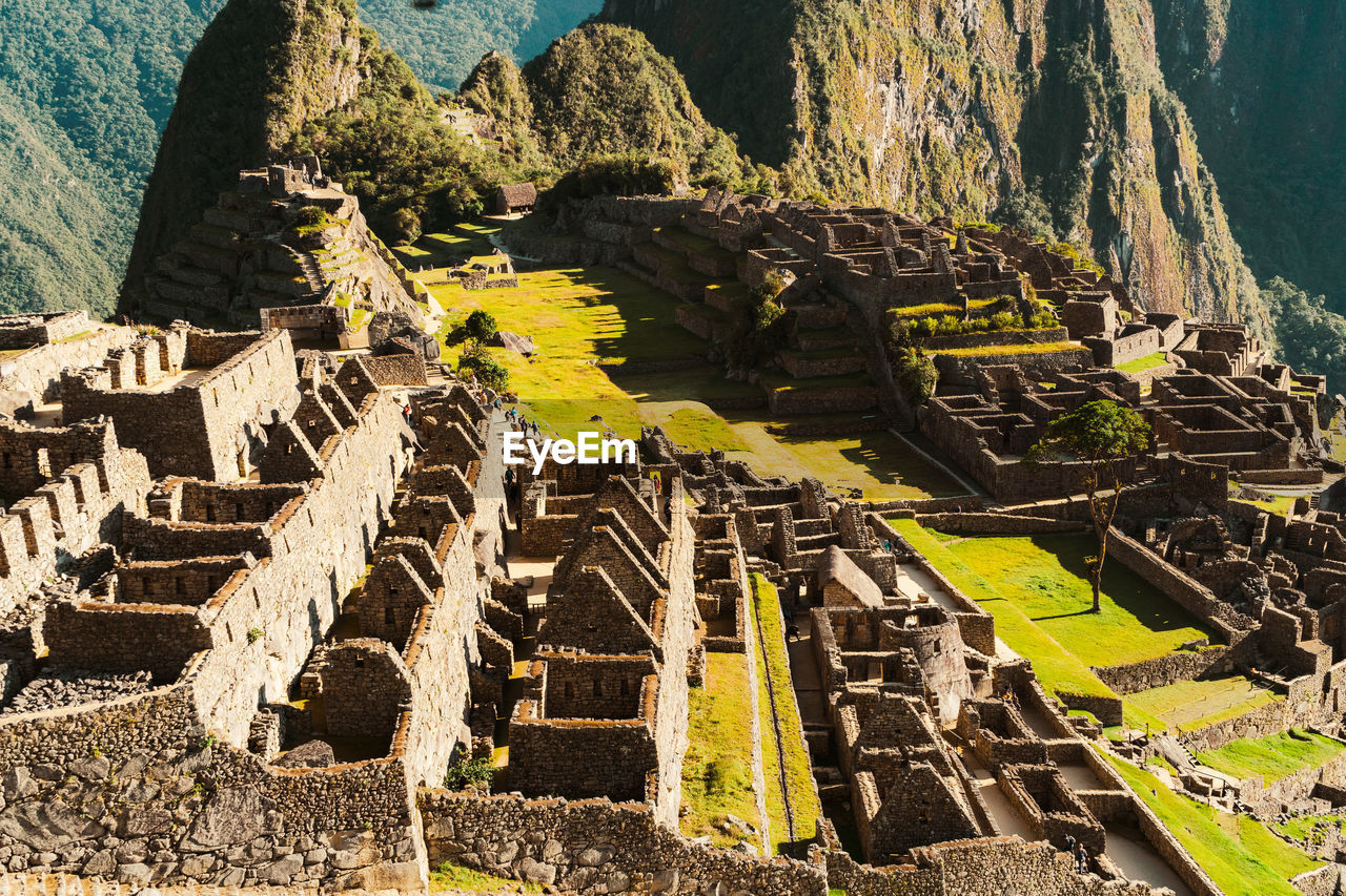 Machu picchu old inca ruins at sunrise in peru