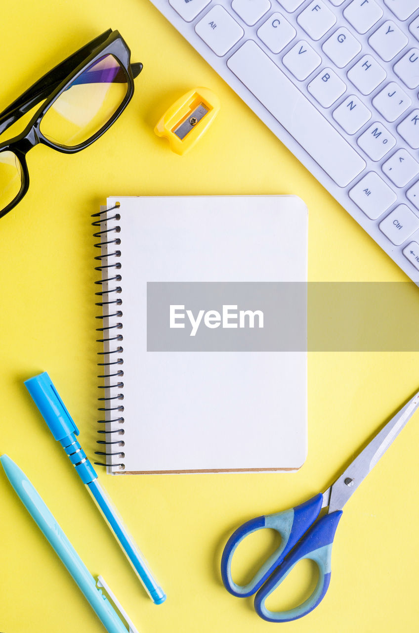 High angle view of office supplies on table