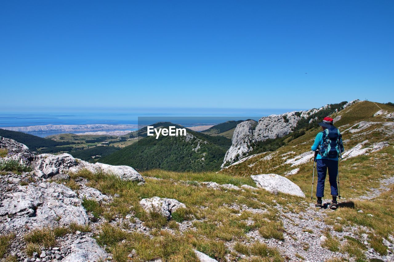 Senior woman hiking in velebit mountain, croatia