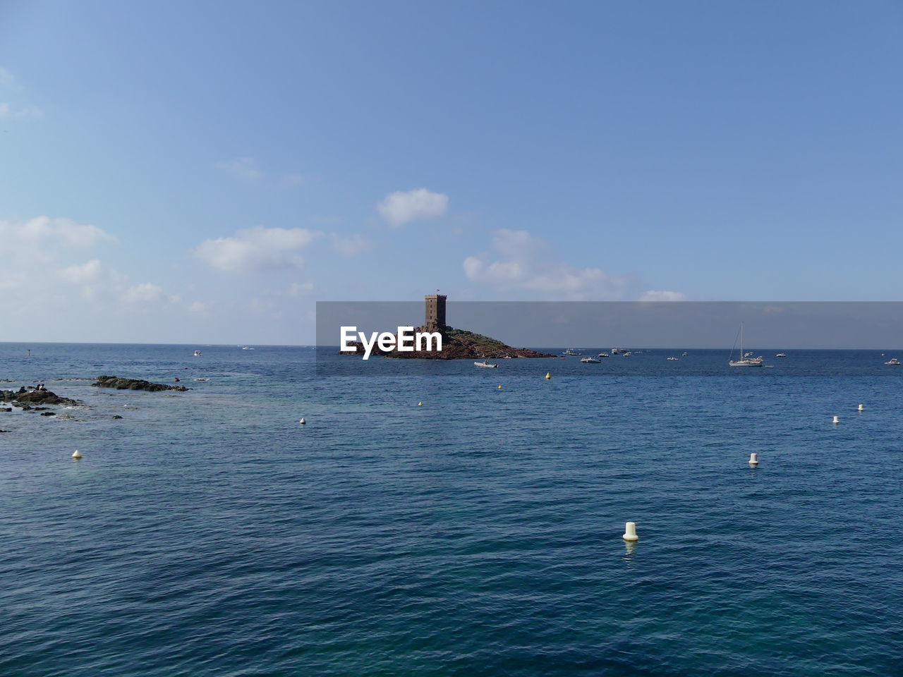 Scenic view of sea against blue sky