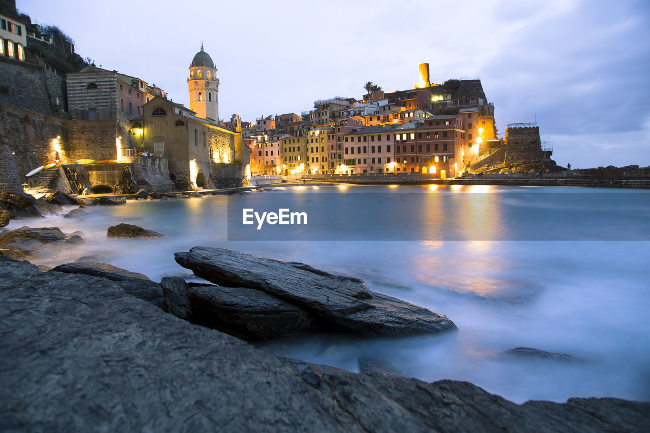 Cinque terre town and harbor seascape after sunset, vernazza, la spezia