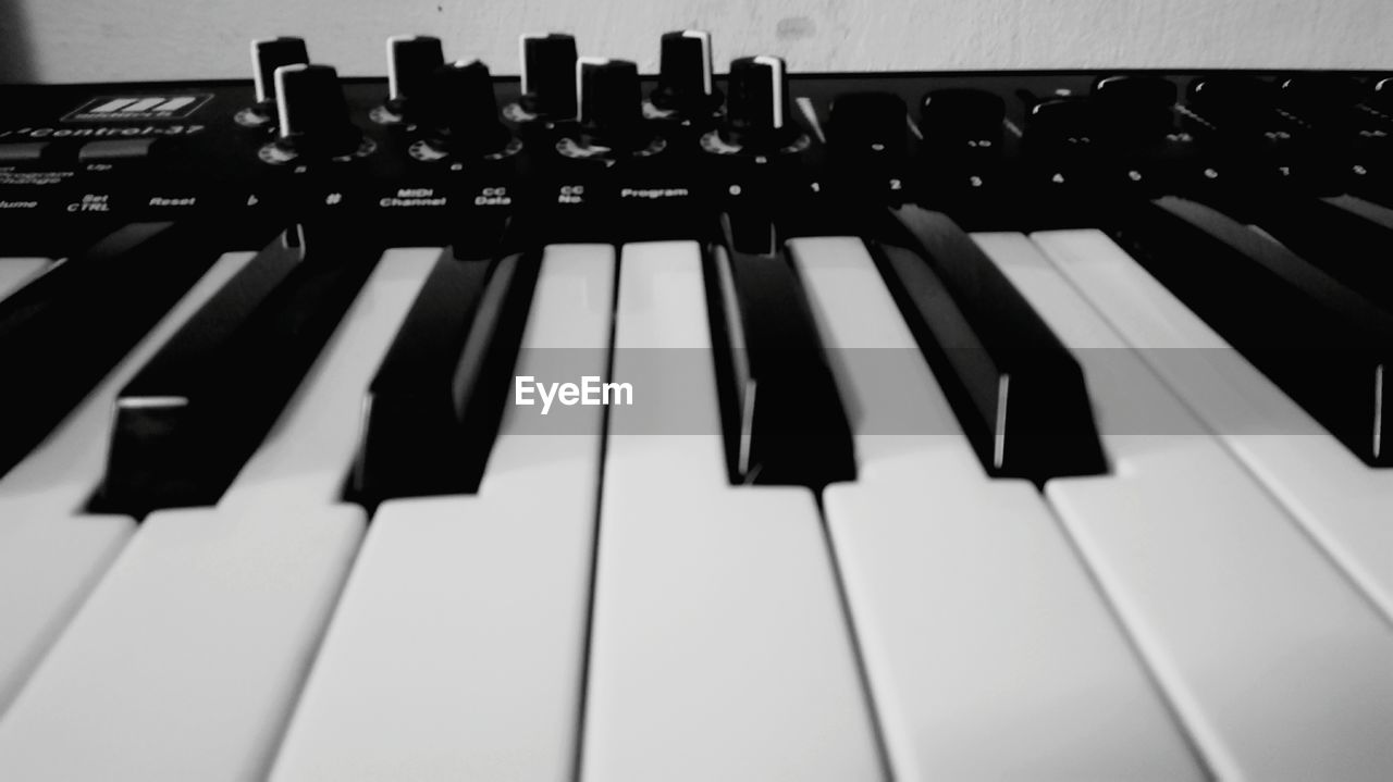 CLOSE-UP OF PIANO KEYS