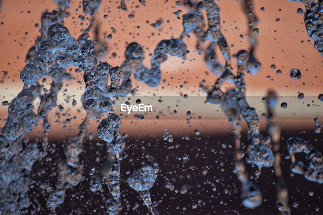 Full frame shot of water drops on window