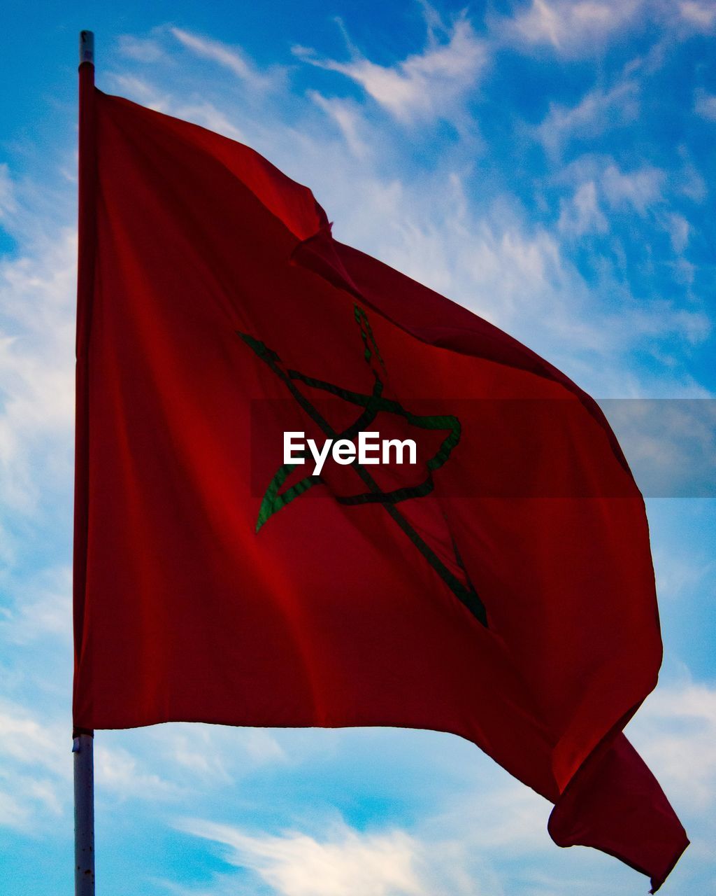 red, flag, sky, cloud, wind, environment, nature, red flag, patriotism, blue, no people, textile, low angle view, outdoors, symbol, day